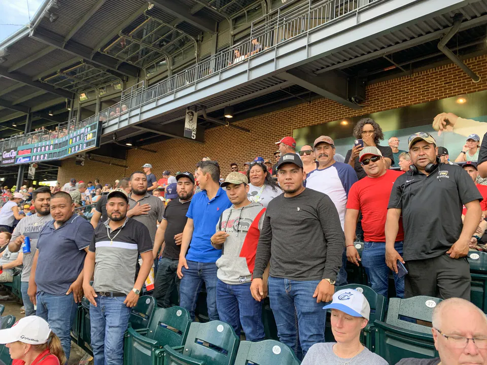 Peabody crew members together at a local baseball game